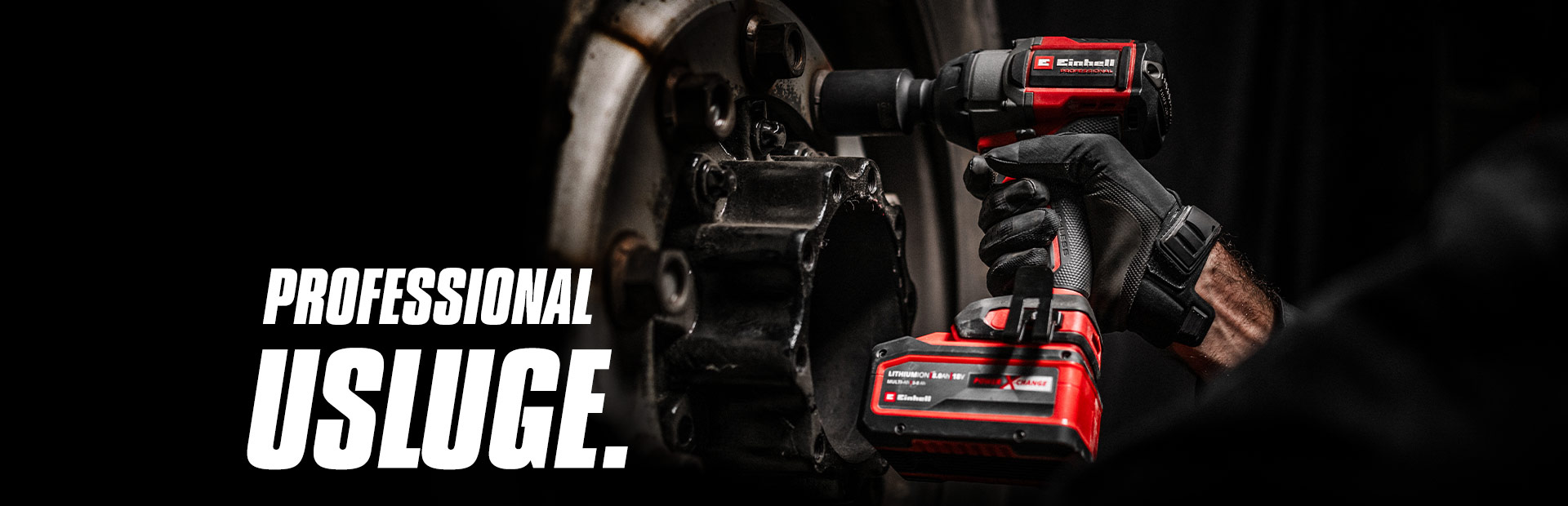 Close-up of a red cordless impact wrench being used on a wheel, with the text "Professional Services".