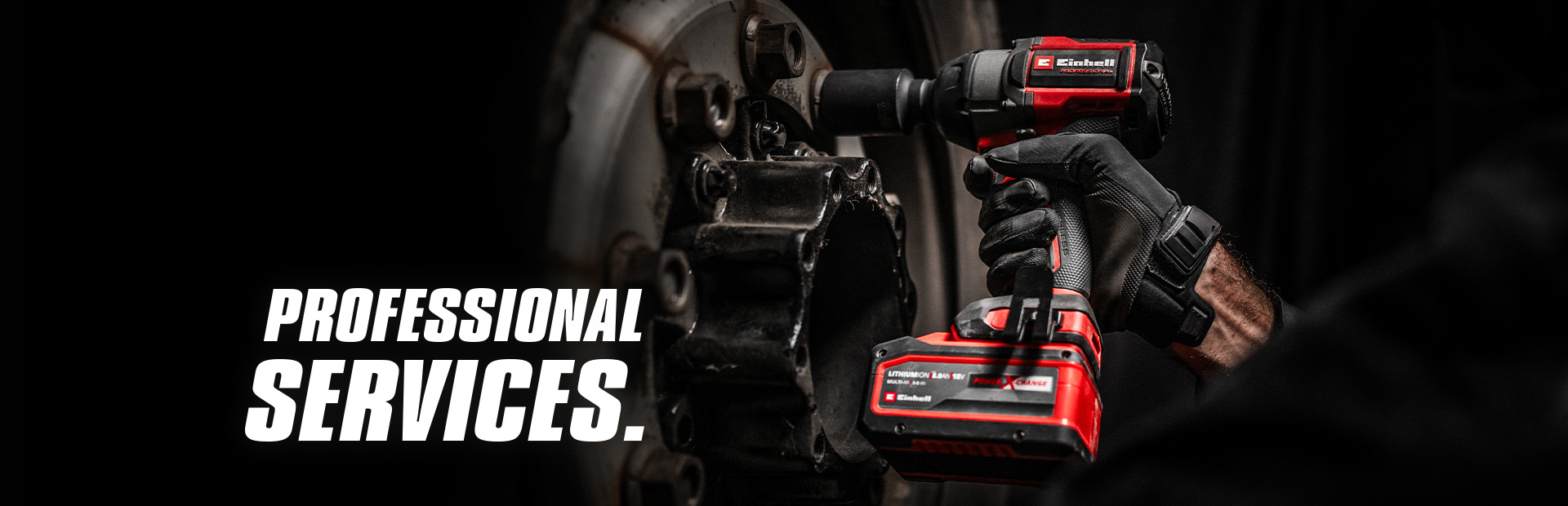 Close-up of a red cordless impact wrench being used on a wheel, with the text "Professional Services".